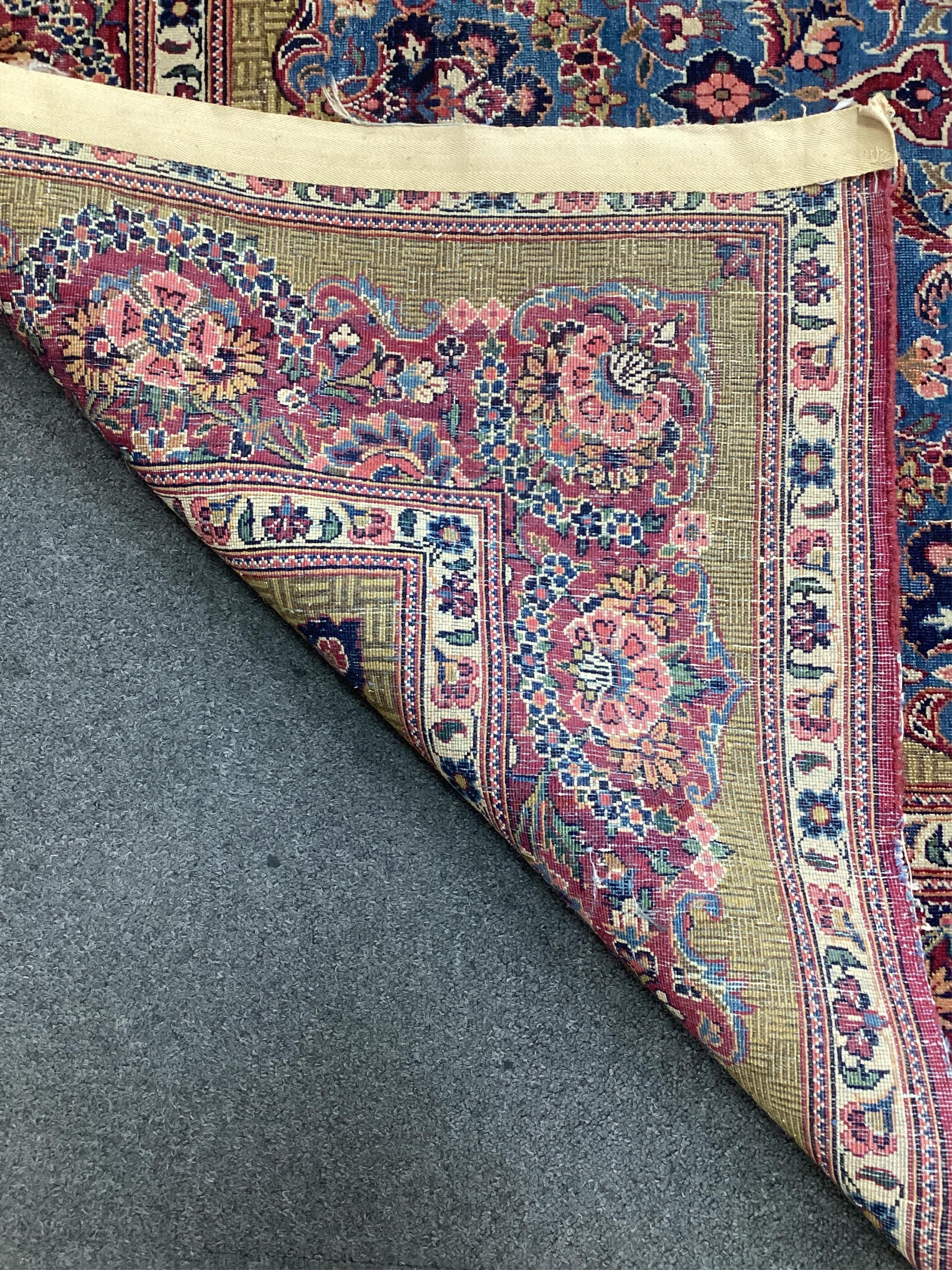 A Kashan blue ground rug, 214 x 128cm. Condition - fair
